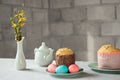 Pastel pink and blue Easter eggs, Russian and Orthodox Easter bread kulich or paska. Happy Easter concept