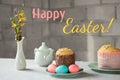 Pastel pink and blue Easter eggs, Russian and Orthodox Easter bread kulich or paska. Happy Easter concept