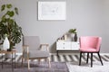 Pastel pink chair in beige living room interior