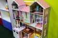 Pastel pink doll house. Games for girls in the entertainment center or at home. Children free time. Retro play kitchen in vintage Royalty Free Stock Photo