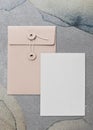 Pastel pink envelope card design in gray background