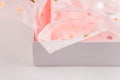 Pastel pink gift paper with golden hearts in white present box. Gift wrapping for special occasion. Valentine`s Day, Birthday Royalty Free Stock Photo