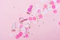 Pastel pink nail polishes and confetti, stars and sparkles. Royalty Free Stock Photo