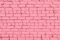 Pastel pink painted rough old brick wall texture. Shabby cement block masonry. Abstract background Royalty Free Stock Photo