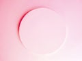 Pastel pink plaster wall decorated with embossed circles. Light background wallpaper for feminine concept