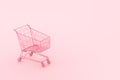 Pastel pink shopping cart on pink background. Black Friday sales minimalistic concept