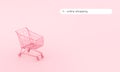 Pastel pink shopping cart on pink background. Black Friday sales minimalistic concept