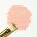 Pastel pink watercolor paint with gold glitter and brush