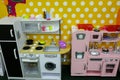 Pastel pink and white toy kitchens. Games for girls in the entertainment center or in the house. Children free time. Retro play Royalty Free Stock Photo