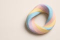 Pastel ring made of twisted plasticine. Space for text. Royalty Free Stock Photo