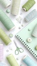 Pastel sewing supplies: thread spools, scissors, buttons, notebook on white background Royalty Free Stock Photo