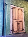 Weathered pastel shutters in Mergozzo, Italy