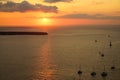 Pastel sunset scenic ocean view in vast Aegean sea with sailing ships silhouette, abstract cloud and light reflection