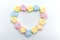 Pastel sweet flowers shape of marshmallows. Heart design for copy space Royalty Free Stock Photo