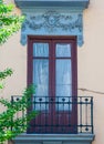 Pastel traditional window and balcony in Spain with stucco decoration Royalty Free Stock Photo