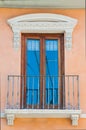 Pastel traditional window in Spain with stucco decoration Royalty Free Stock Photo