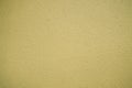 Pastel yellow plastered wall texture background