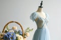 pastelcolored summer dress on mannequin with flower basket