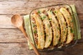 Pastelon de Platano Maduro is a close-up of banana lasagna in a baking dish. Horizontal top view