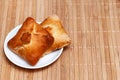 Pasties stuffed meat on bamboo napkin, close up Royalty Free Stock Photo