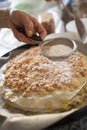 Pastilla filling preparation with icing sugar spreaded with straner