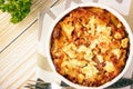 Pastitsio -greek casserole with pasta, meat, tomatoes and feta cheese.