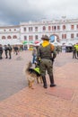 PASTO, COLOMBIA - JULY 3, 2016: policeman standing next to a trained police dog in the central square Royalty Free Stock Photo