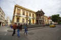 PASTO, COLOMBIA - JULY 3, 2016: some people crossing the street in front of the government building of the city