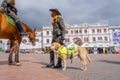 PASTO, COLOMBIA - JULY 3, 2016: unidentified policeman standing on the central square with a policedog