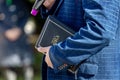 Pastor with a Bible in his hand during a sermon. The preacher delivers a speech