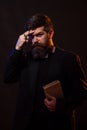 Pastor or preacher with the Bible. Praying hands priest portrait of male pastor. Royalty Free Stock Photo