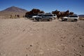 A group of tourist 4x4 vehicles in the desert in the Sud Lipez Region of Bolivia.