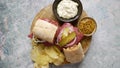 Pastrami sandwhich with delicious meet on baguette bread with chedder cheese, onion