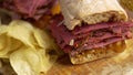 Pastrami sandwhich with delicious meet on baguette bread with chedder cheese, onion