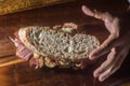 Pastrami sandwhich on a wooden tablet with delicious meet on baguette bread with cheese,copy space in parts of the image