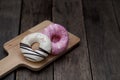 Glazed mini donuts on wooden background