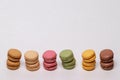 Pastries, desserts and sweets.  Close-up of multicolord original french macaroon cookies are arranged in piles on a sparkling Royalty Free Stock Photo