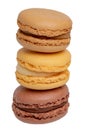 Pastries, desserts and sweets. Close-up of a yellow french vanilla macaroon, a yellow lemon macaroon and a brown chocolate