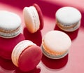 French macaroons on wine red background, parisian chic cafe dessert, sweet food and cake macaron for luxury confectionery brand, Royalty Free Stock Photo