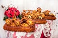 Pastry cakes stuffed with yeast dough, decorated with figures and flowers made of dough - bread art, ornate wedding bread
