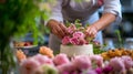 A pastry chef arranging edible flowers on a stunning wedding cake Royalty Free Stock Photo