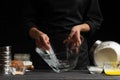 A pastry chef or baker prepares the dough by whipping with a spoon, for sweets, rolls or Italian pizza or pasta. Freeze in motion Royalty Free Stock Photo