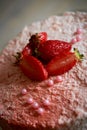 The pastry chef cut the cake. Strawberry yogurt cake. Consists of butter sponge cakes,covered with cream-based live Royalty Free Stock Photo