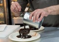 Pastry chef decorating, chef preparing desert chocolate cake Royalty Free Stock Photo