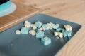 pastry chef made edible letters in blue Delicious food on the table