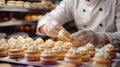 A pastry chef is making a batch of pastries, including macaroons Royalty Free Stock Photo