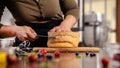 The pastry chef prepares a biscuit cake in the home kitchen or in a restaurant. The concept of the process of making cakes