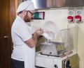 Pastry chef prepares hazelnut cake