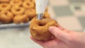 Pastry chef at work prepares and stuffs sweets in confectionery