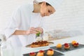 Pastry cook preparing a cake Royalty Free Stock Photo